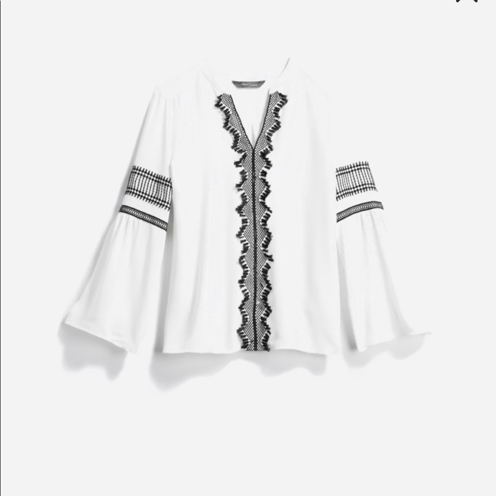 Beautiful off white top with black crochet details
